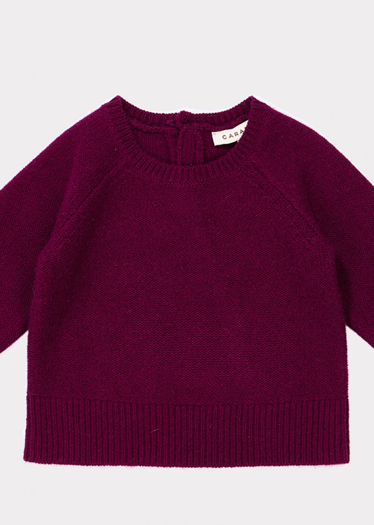 女婴深红色羊绒毛衣