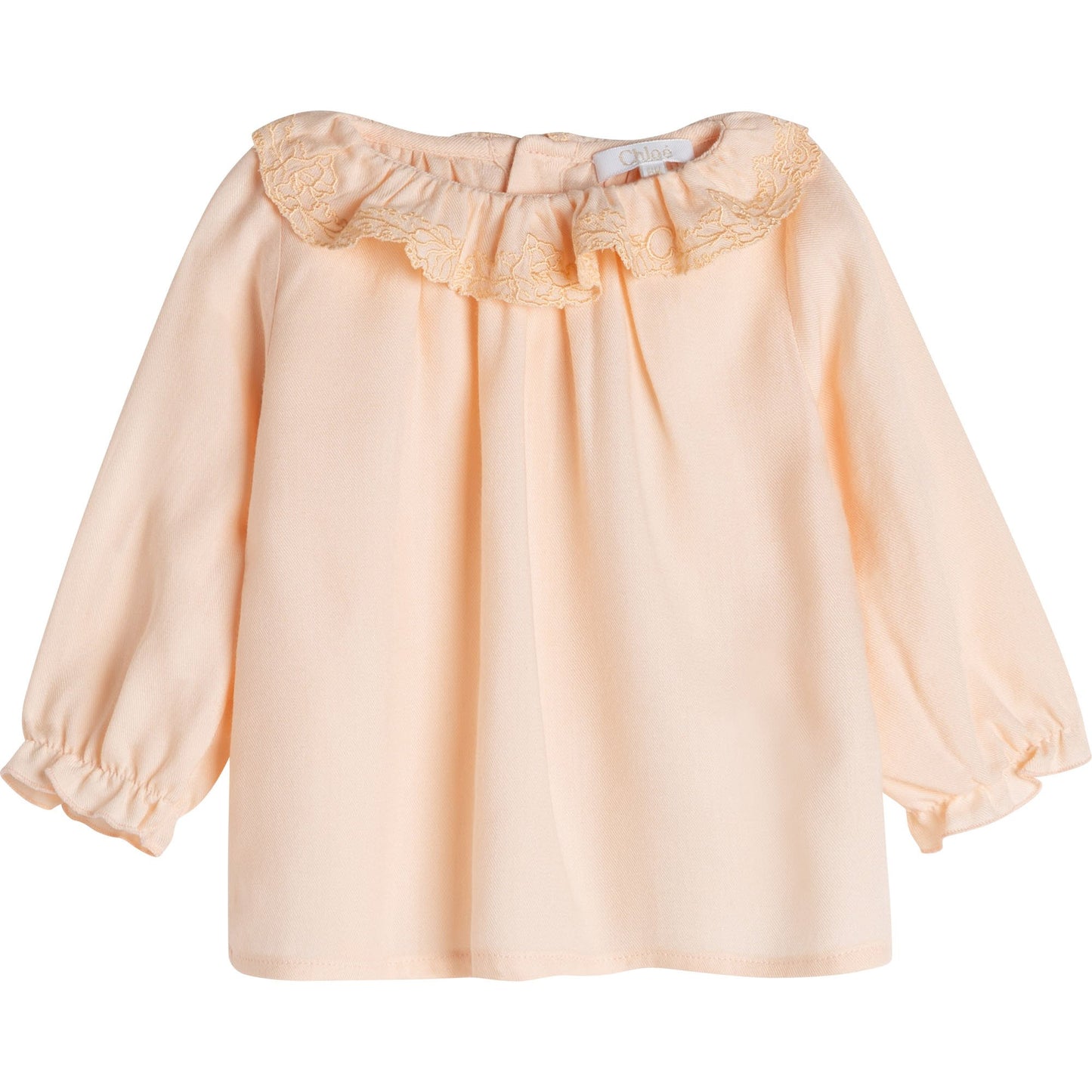 女婴杏黄色荷叶边上衣